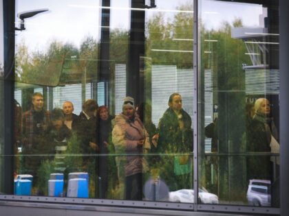 People queue at the passport check at the border checkpoint crossing in Vaalimaa, Finland, on the border with the Russian Federation on September 29, 2022. - Fearing the border may close "forever" after the Russian President's mobilisation order for the war in Ukraine, Russians are rushing to flee across Finland's …