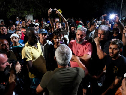 A government official speaks with people as they protest the lack of power in the aftermath Hurricane Ian in Havana, on September 1, 2022. - Electricity knocked out by Hurricane Ian was almost completely restored October 1, 2022 in Havana, the utility company said, after a second night of protests …