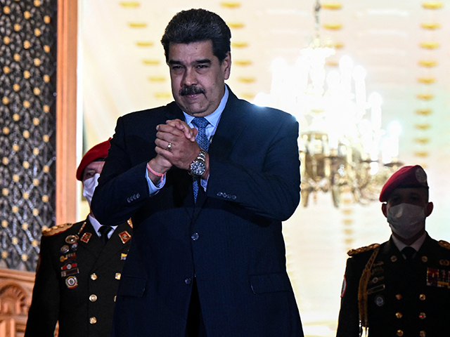 Venezuelan President Nicolas Maduro gestures after a meeting with Colombia's Foreign Minister Alvaro Leyva, (out of frame) at Miraflores presidential palace in Caracas on October 4, 2022. - Caracas and Bogota --which had broke off diplomatic relations in 2019 under Colombia's conservative president Ivan Duque-- formally reestablished diplomatic relations last …