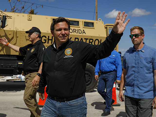 Ron DeSantis, governor of Florida, waves as he arrives to a news conference in Matlacha, Florida, US, on Wednesday, Oct. 5, 2022. DeSantis and President Biden have feuded over political issues, including migrants, but are coordinating on assistance for Floridians hit by a hurricane Biden's called "among the worst in the nation's history." Photographer: Eva Marie Uzcategui/Bloomberg via Getty Images