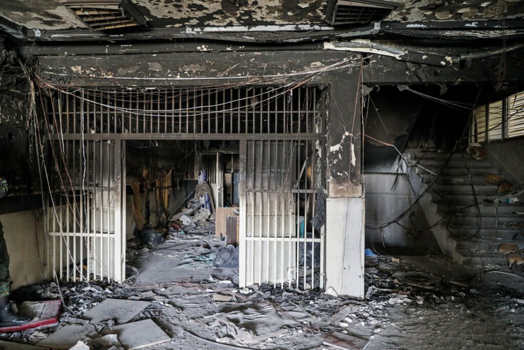A picture obtained from the Iranian Mizan News Agency on October 16, 2022 shows damage caused by a fire in the notorious Evin prison, northwest of the Iranian capital Tehran. - Eight Iranian inmates were killed in a fire that raged through Tehran's notorious Evin prison, the judiciary said on October 17, doubling the official toll from the blaze that further stoked tensions one month into protests sparked by the death of Mahsa Amini. Authorities in the Islamic republic have blamed the fire late on October 15 on "riots and clashes" among prisoners, but human rights groups said they doubted the official version of events and also feared the real toll could be even higher. (Photo by KOOSHA MAHSHID FALAHI / MIZAN / AFP) (Photo by KOOSHA MAHSHID FALAHI/MIZAN/AFP via Getty Images)