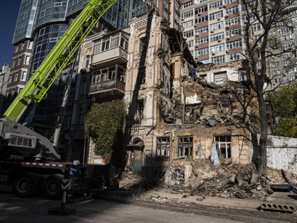 Rescue workers inspect a building destroyed by Russian drone strikes as they continue their field work following the wave of Russia's attacks in Kyiv, Kyiv Oblast, Ukraine on October 18, 2022. Local authorities reported airstrikes in Ukraineâs capital Kyiv on Tuesday morning, as a wave of drone and missile strikes …