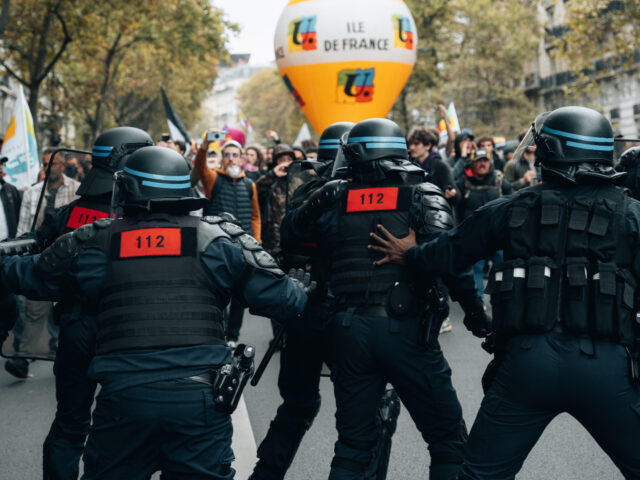 Riot police face the union procession after black bloc activists took refuge there during a protest in Paris, October 18, 2022, after the CGT and FO unions called for a national strike for a raise wages, and against the requisition by the government to force certain strikers in the refineries …
