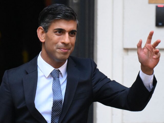 New Conservative Party leader and incoming prime minister Rishi Sunak waves as he leaves f