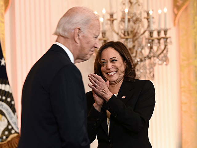 US Vice President Kamala Harris (L) claps to US President Joe Biden as he hosts a reception to celebrate Diwali in the East Room of the White House in Washington, DC, on October 24, 2022. (Photo by Brendan SMIALOWSKI / AFP) (Photo by BRENDAN SMIALOWSKI/AFP via Getty Images)