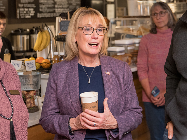U.S. Sen. Cory Booker (D-NJ) and U.S. Sen. Maggie Hassan (D-NH) speak to people at a coffe