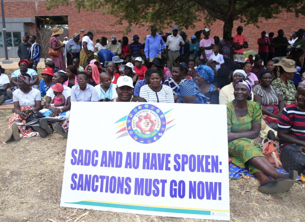 People gather outside the United States Embassy compound on the Anti-Sanctions Day in Harare, Zimbabwe, on Oct. 25, 2022. Thousands of Zimbabweans on Tuesday gathered outside the United States Embassy compound in Harare to protest against sanctions imposed on the southern African nation by Western countries over two decades ago.TO GO WITH "Feature: Zimbabwean youth protest against U.S.-imposed sanctions on Anti-Sanctions Day" (Photo by Shaun Jusa/Xinhua via Getty Images)