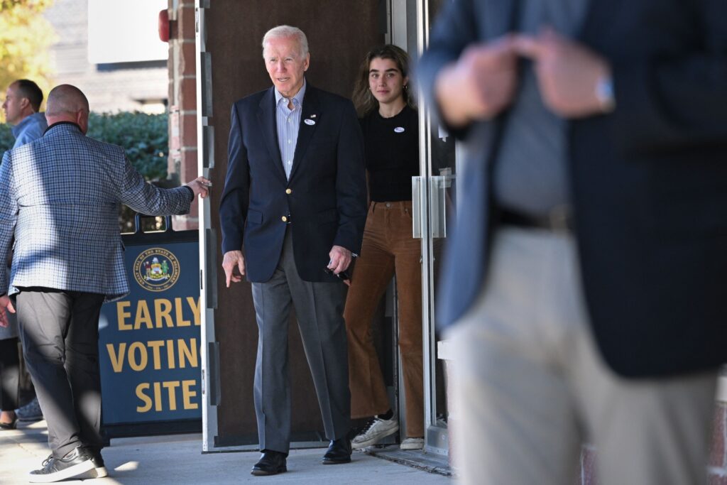 US President Joe Biden leaves after voting early in the midterm elections with his granddaughter Natalie Biden in Wilmington, Delaware on October 29, 2022. - Natalie Biden is a first-time voter and daughter of the late Beau Biden. (Photo by Mandel NGAN / AFP) (Photo by MANDEL NGAN/AFP via Getty Images)
