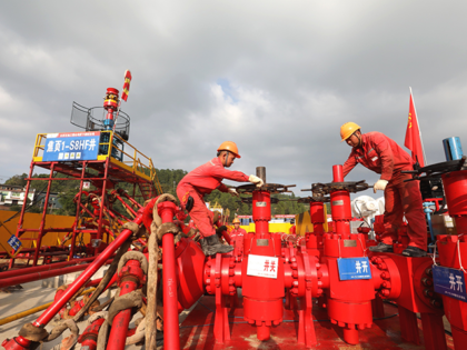 Technicians work at China Petroleum and Chemical Corp (Sinopec) Fuling shale gas field on October 8, 2021 in Chongqing, China. The Fuling shale gas field has produced more than 40 billion cubic meters of shale gas as of Friday, according to Sinopec. (Photo by Luo Bin/VCG via Getty Images)