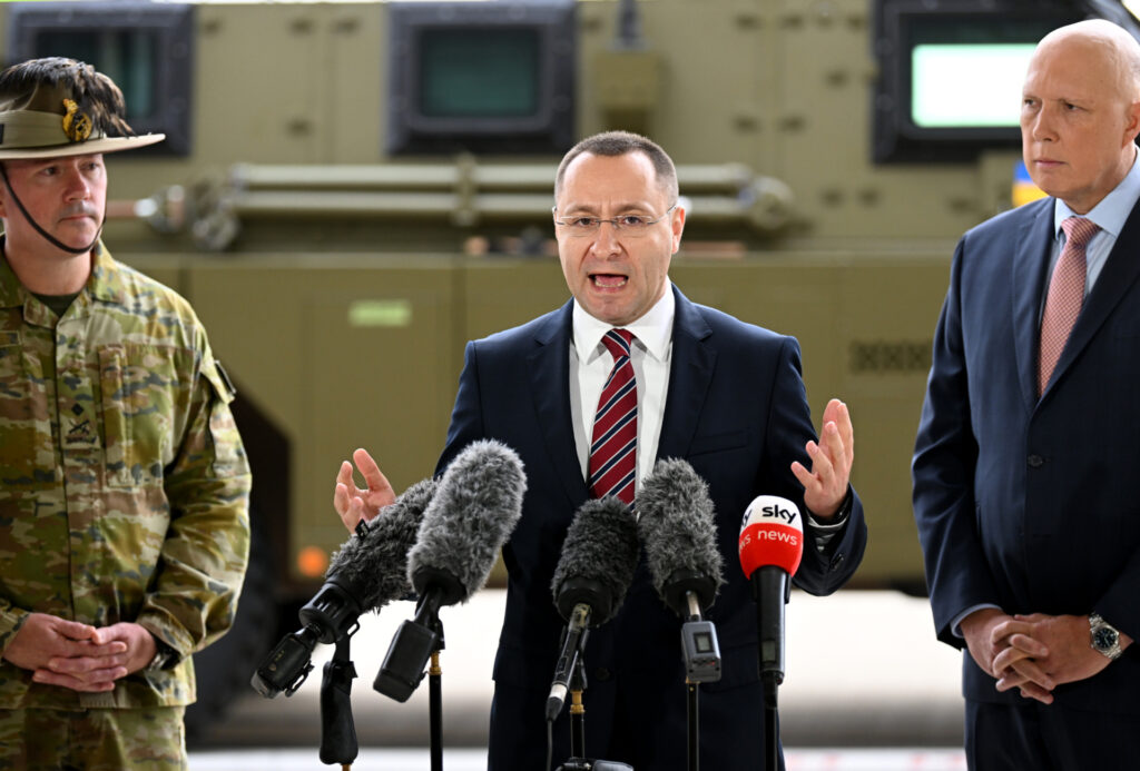 IPSWICH, AUSTRALIA - APRIL 08: Ambassador of Ukraine to Australia Vasyl Myroshnychenko (C), joined by Australian Defence minister Peter Dutton (R), speaks during a press conference at the Amberley Air Base on April 08, 2022 in Ipswich, Australia. The Australian government is sending a total of 20 Bushmaster Protected Mobility Vehicles to Ukraine following a direct request for assistance by Ukrainian President Volodymyr Zelenskyy during his virtual address to the Australian parliament last Thursday. (Photo by Dan Peled/Getty Images)