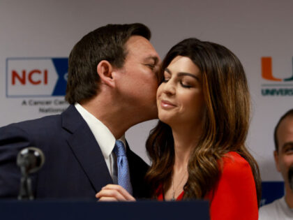 MIAMI, FLORIDA - MAY 17: Florida Gov. Ron DeSantis kisses his wife, first lady Casey DeSantis, who recently survived breast cancer, as he introduces her to speak during a press conference at the University of Miami Health System Don Soffer Clinical Research Center on May 17, 2022 in Miami, Florida. …