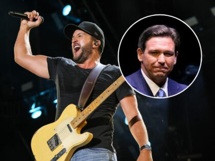 (INSET: Ron DeSantis) Luke Bryan performs during day 3 of CMA Fest 2022 at Nissan Stadium on June 11, 2022 in Nashville, Tennessee. (Photo by Terry Wyatt/WireImage)