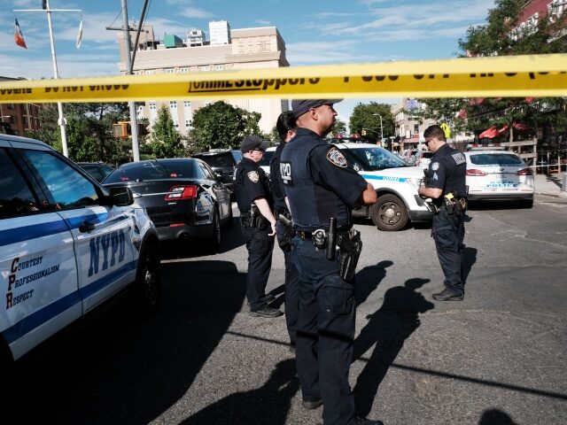NEW YORK, NEW YORK - JUNE 23: Police gather at the scene of a shooting where an officer was shot in his patrol car in Brooklyn on June 23, 2022 in New York City. The shooting comes on the day that the Supreme Court ruled that New York's laws were …