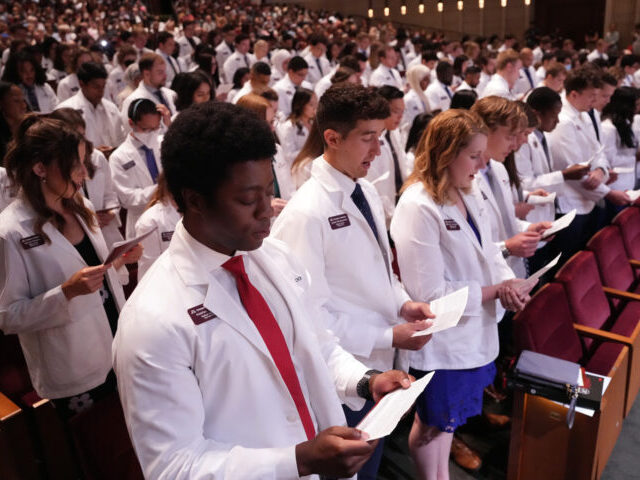 MINNEAPOLIS, MN. - AUGUST 2022: Medical student Nobles Antwi and his classmates recite an