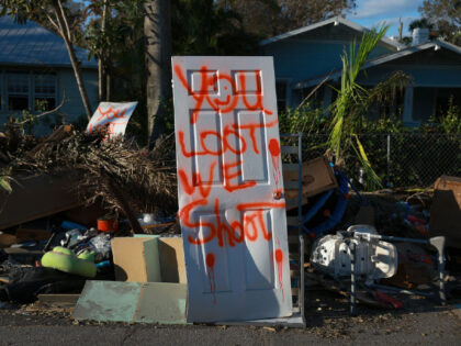 FORT MYERS, FLORIDA - OCTOBER 07: A spray painted door reads 'you loot. we shoot.' on October 07, 2022 in Fort Myers, Florida. Hurricane Ian brought high winds, storm surges, and rain to the area, causing severe damage. ( (Photo by Joe Raedle/Getty Images)