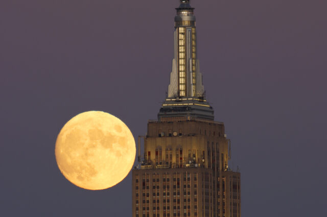 UNION CITY, NJ - OCTOBER 8: The Hunter's Moon rises behind the Empire State Building