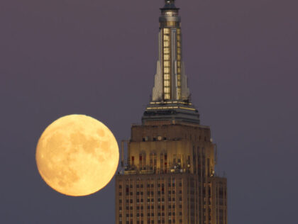 UNION CITY, NJ - OCTOBER 8: The Hunter's Moon rises behind the Empire State Building