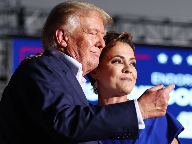 MESA, ARIZONA - OCTOBER 09: Former U.S. President Donald Trump (L) embraces Arizona Republican nominee for governor Kari Lake, who he has endorsed, during a campaign rally attended by former U.S. President Donald Trump at Legacy Sports USA on October 09, 2022 in Mesa, Arizona. Trump was stumping for Arizona GOP candidates, including gubernatorial nominee Kari Lake, ahead of the midterm election on November 8. (Photo by Mario Tama/Getty Images)