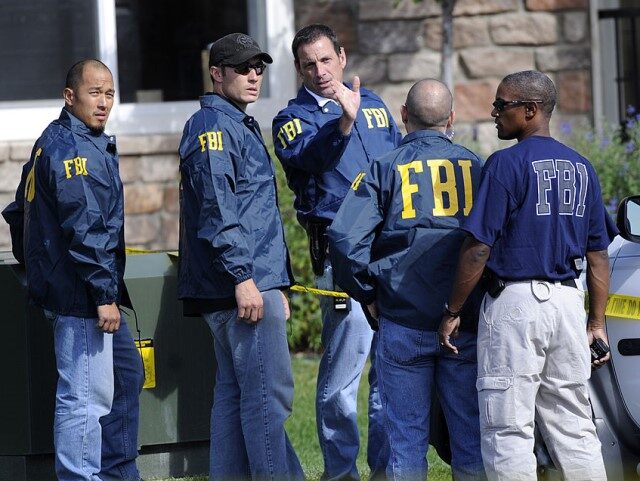 FBI agents talk outside the scene of a raid of the apartment of Najibullah Zazi at the Vistas Apartment Complex at 22959 East Smoky Hill Road in Aurora, Wednesday afternoon, September 16, 2009. Hyoung Chang, The Denver Post (Photo By Hyoung Chang/The Denver Post via Getty Images)
