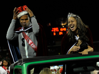 Homecoming king and queen Kris Lawrie and Jazmin Evans reveled in the attention Saturday n