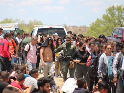 A large migrant group crosses the Rio Grande into Texas. (Randy Clark/Breitbart Texas)