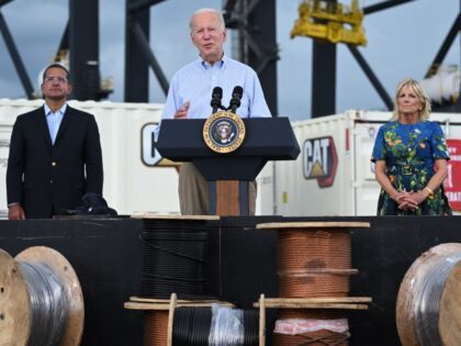 President Joe Biden, flanked by first lady Jill Biden and Puerto Rico Governor Pedro Pierluisi, delivers remarks in the aftermath of Hurricane Fiona in Ponce, Puerto Rico, on October 3, 2022. Biden flew to Puerto Rico on Monday to inspect storm damage, saying in a veiled jab at his predecessor …