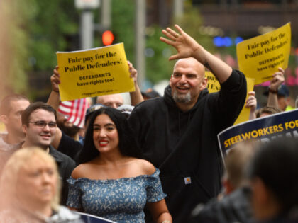 John Fetterman, lieutenant governor of Pennsylvania and Democratic senate candidate, center, and his wife Gisele Fetterman, center left, walk with the United Steelworkers District 10 union during a Labor Day parade in Pittsburgh, Pennsylvania, US, on Monday, Sept. 5, 2022. Pennsylvania is holding a number of high-profile election contests, including …