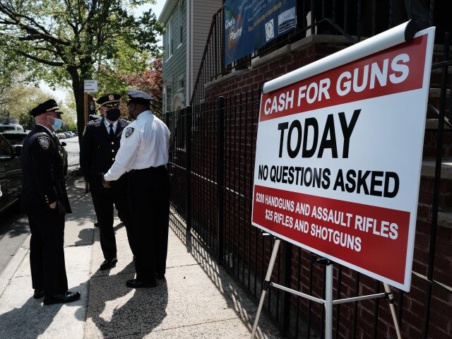 NYPD Offers IPads in Exchange For Turning In Guns A sign advertises a gun buy-back event a