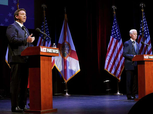 Florida's Republican Gov. Ron DeSantis, left, speaks during a debate with his Democratic o
