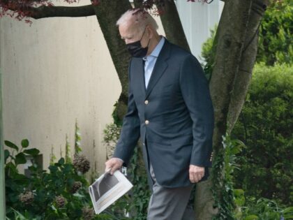 President Joe Biden carries a newspaper as he leaves St. Joseph on the Brandywine Catholic Church after Sunday Mass on May 16, 2021, in Wilmington, Delaware. President Joe Biden expressed his "grave concern" over violence in Israel and Gaza in a phone call with Israeli Prime Minister Benjamin Netanyahu on …