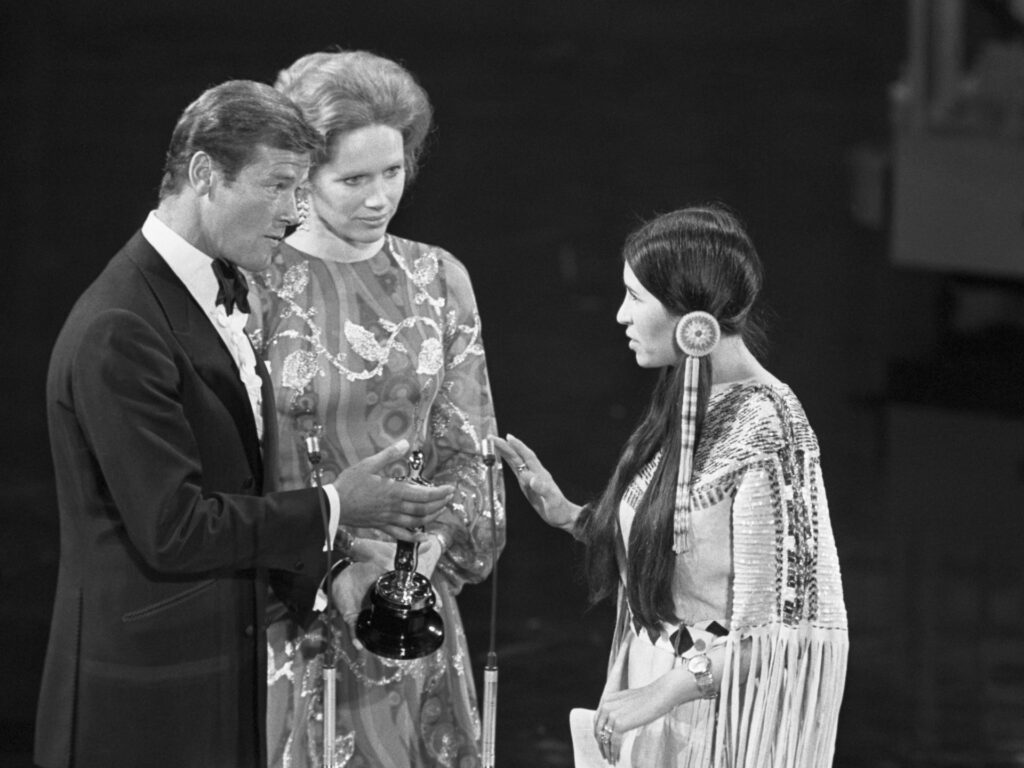 At the 1973 Academy Awards, Sacheen Littlefeather refuses the Academy Award for Best Actor on behalf of Marlon Brando who won for his role in The Godfather. She carries a letter from Brando in which he explains he refused the award in protest of American treatment of the Native Americans.