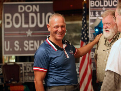 New Hampshire Republican U.S. Senate candidate Don Bolduc chats with supporters during a p
