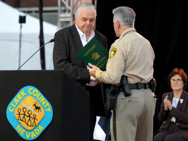 LAS VEGAS, NEVADA - OCTOBER 01: Nevada Gov. Steve Sisolak (L) and Clark County Sheriff Joe