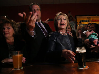 U.S. Rep Tim Ryan (D-OH) (R) and democratic presidential candidate former Secretary of State Hillary Clinton have beer at O'Donold's Irish Pub and Grill on March 12, 2016 in Youngstown, Ohio. Hillary Clinton is campaigning in Missouri and Ohio. (Photo by Justin Sullivan/Getty Images)