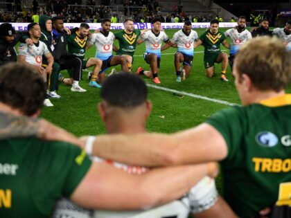 LEEDS, ENGLAND - OCTOBER 15: Australia and Fiji players sing together after Rugby League World Cup 2021 Pool B match between Australia and Fiji at Headingley on October 15, 2022 in Leeds, England. (Photo by Gareth Copley/Getty Images)