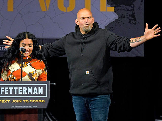Pennsylvania Lt. Gov. John Fetterman, the Democratic nominee for the state's U.S. Senate seat, is introduced by wife Gisele Barreto Fetterman, left, during a rally in Erie, Pa., on Friday, Aug. 12, 2022. (AP Photo/Gene J. Puskar)
