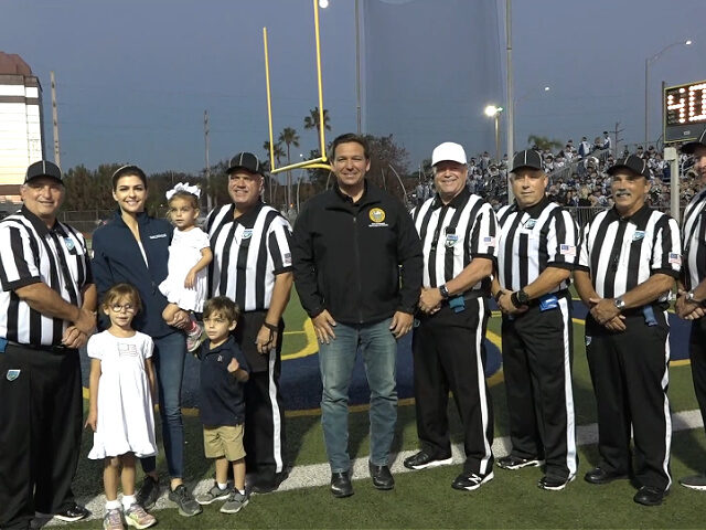 Florida Gov. Ron DeSantis (R) traveled to Naples to perform the opening coin toss at a loc