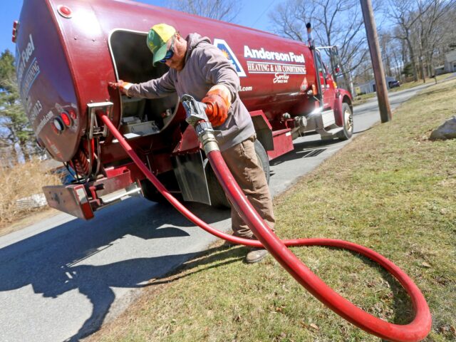 SCITUATE, MA - March 8: Corey Carlson of Anderson Fuel after filling a house with home heating oil which has risen to over $5.00 a gallon on March 8, 2022 in Scituate, Massachusetts. (Photo by Matt Stone/MediaNews Group/Boston Herald via Getty Images)