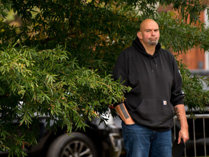 Pennsylvania's Lieutenant Governor John Fetterman waits to speak to supporters gathered in Dickinson Square Park in Philadelphia on October 23, 2022, as he campaigns for the US Senate. - The US midterm election is scheduled for November 8, 2022. (Photo by Kriston Jae Bethel / AFP) (Photo by KRISTON JAE …
