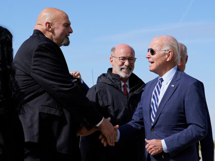 President Joe Biden speaks with Pennsylvania Lt. Gov. John Fetterman, a Democratic candidate for U.S. Senate, after stepping off Air Force One, Thursday, Oct. 20, 2022, at the 171st Air Refueling Wing at Pittsburgh International Airport in Coraopolis, Pa. Biden is visiting Pittsburgh to promote his infrastructure agenda. (AP Photo/Patrick …