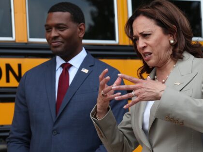 FALLS CHURCH, VIRGINIA - MAY 20: U.S. Vice President Kamala Harris tours new electric powered school buses while visiting Meridian High School with EPA Administrator Michael Regan (L) May 20, 2022 in Falls Church, Virginia. During the event, Harris announced the release of $500 million in funding from the $5 …