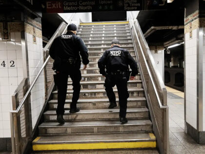 NEW YORK, NEW YORK - APRIL 25: Police search for a suspect in a Times Square subway station following a call to police from riders on April 25, 2022 in New York City. According to new data released by the NYPD, felony assaults on the New York City transit system …