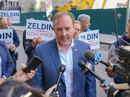 Republican candidate for New York Governor Congressman Lee Zeldin, center, speaks to reporters before marching in the annual Columbus Day Parade, Monday, Oct. 10, 2022, in New York. (AP Photo/Mary Altaffer)