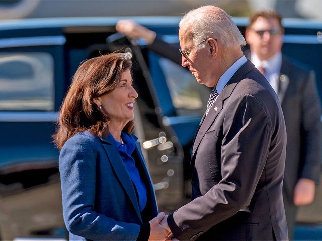President Joe Biden is greeted by New York Gov. Kathy Hochul as he arrives at Stewart Air National Guard Base in Newburgh, N.Y., Thursday, Oct. 6, 2022. (AP Photo/Andrew Harnik)