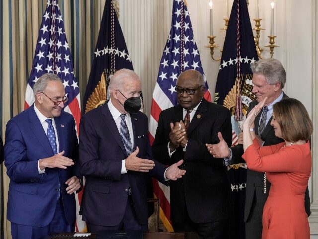WASHINGTON, DC - AUGUST 16: U.S. President Joe Biden (C) celebrates after signing The Infl