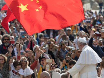 A group of pilgrim from China waves a red flag during the Pope Francis weekly general audience in St Peter Square at the Vatican, Wednesday, May 22, 2019. (Photo by Massimo Valicchia/NurPhoto via Getty Images)