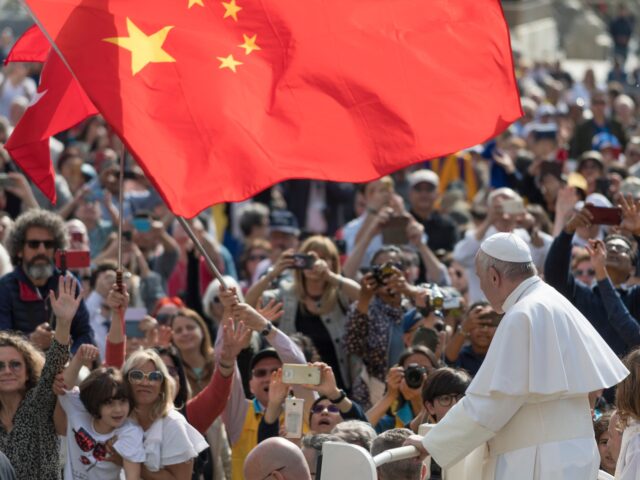 A group of pilgrim from China waves a red flag during the Pope Francis weekly general audi