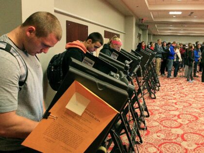 Voters at the polls stand on line waiting to vote November 6, 2012 in Columbus, Ohio. U.S.