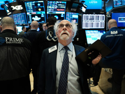 NEW YORK, NEW YORK - MARCH 09: Stock trader Peter Tuchman works on the floor of the New York Stock Exchange (NYSE) on March 09, 2020 in New York City. As global fears from the coronavirus continue to escalate, trading was halted for 15 minutes after the opening bell as …