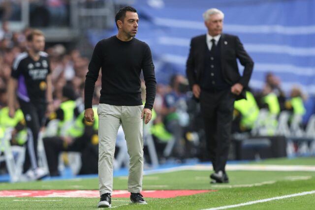 Barcelona coach Xavi reacts on the sideline during the Clasico